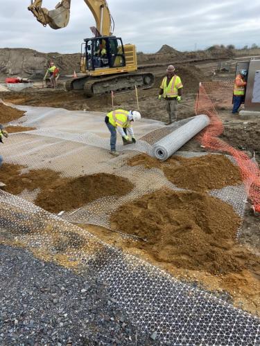 4-18-24-Construction-workers-laying-geogrid-down-at-southeast-corner-of-Parcel-A